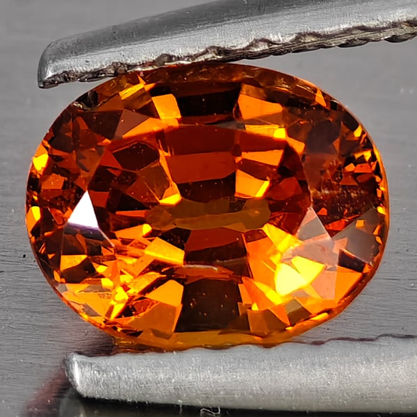 Natural Orange Spessartine Garnet Gemstone 0.97 Ct. Oval Shape 6.6 x 5.4 Mm.: Product ID: 802937825 Product Name: Natural Spessartine Weight: 0.97 CT. Size: 6.6 x 5.4 x 4 MM. Shape: Oval Shape Color: Orange Clarity:VSI Luster: Good Gems Origin: Namibia Treatment: Unheated Cryst