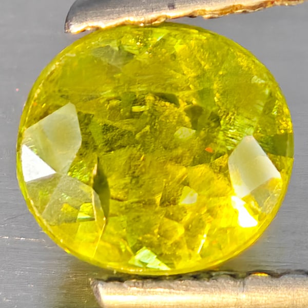 Natural Multi-Color With Rainbow Spark Sphene Gemstones 1.50 Ct. Oval Shape 6.5 x 6 Mm.: Product ID: 806509161 Product Name: Natural Sphene Weight: 1.50 CT. Size: 6.5 x 6 x 5 MM. Shape: Oval Shape Color: Multi-Color With Rainbow Spark Clarity:SI1 Luster: Good Gems Origin: Madagascar Treat