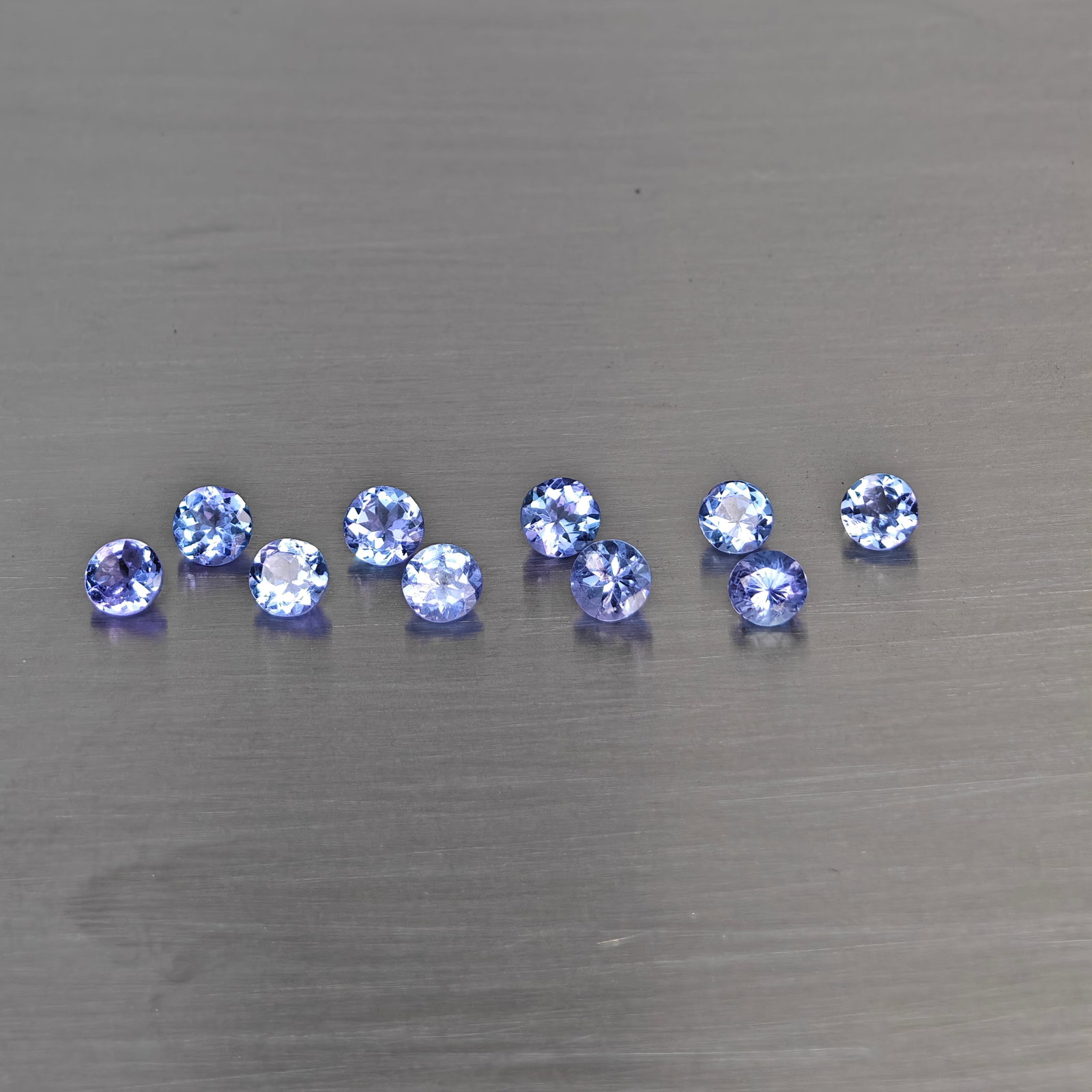 Natural Violetish Blue Tanzanite Gemstones 1.87 Ct. 10 Pcs. Round Shape 3.6 Mm.: Product ID: 807015096 Product Name: Natural Weight: 1.87 CT. Size: 3.6 x 3.6 x 2.2 MM. Shape: Round Color: Violetish Blue Clarity:VSI Luster: Good Gems Origin: Tanzania Treatment: Heated Crystal Struc