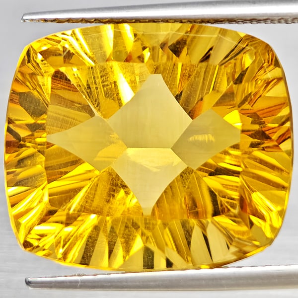 Natural Yellow Citrine Gemstones 17.90 Ct. Cushion Concave Cut 18.3 x 15.6 Mm.: Product ID: 801815394 Product Name: Natural Citrine Weight: 17.90 CT. Size: 18.3 x 15.6 x 10 MM. Shape: Cushion Concave Cut Color: Yellow Clarity:VSI Luster: Very Good Gems Origin: Brazil Treatment: U