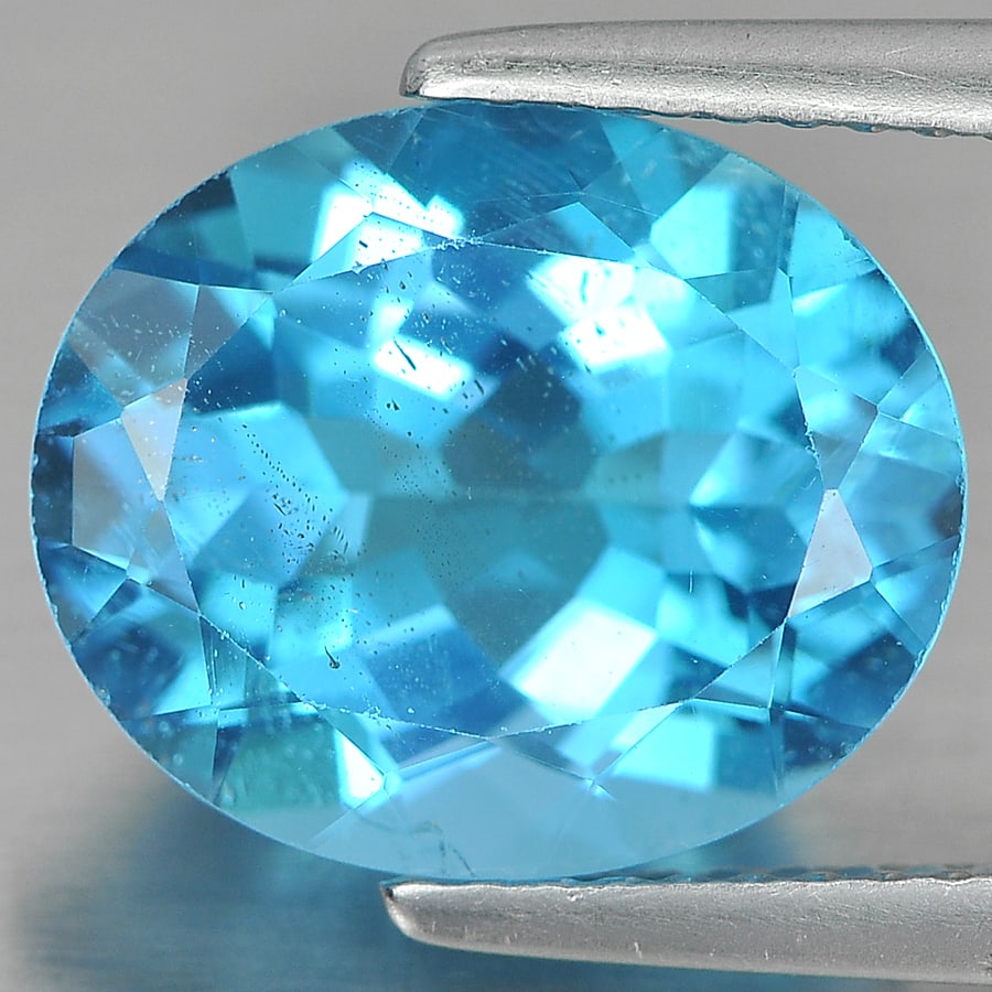 Natural Swiss Blue Topaz Gemstones 5.69 Ct. Oval Shape 12 x 10 Mm.: Product ID: 807161196 Product Name: Natural Blue Topaz Weight: 5.69 CT. Size: 12 x 10 x 6.4 MM. Shape: Oval Color: Blue Clarity:VSI Luster: Good Gems Origin: Brazil Treatment: Treated Crystal Structur