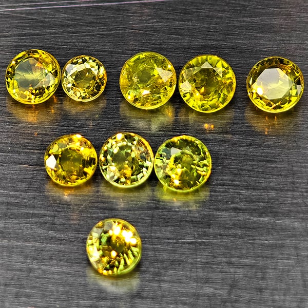 Natural Greenish Yellow Titanium Sphene Gemstones Rainbow Spark 1.12 Ct. 9 Pcs. Round Shape Mixed: Product ID: 806509439 Product Name: Natural Sphene Weight: 1.12 CT. Size: 3.3 x 3.3 x 2.2 to 2.7 x 2.7 x 1.8 MM. Shape: Round Shape Color: Greenish Yellow Titanium Rainbow Spark Clarity:SI1 Luster: Go