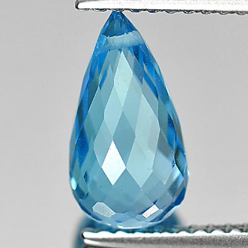 Natural Swiss Blue Topaz Gemstones 2.78 Ct. Briolette with Drilled 10.7 x 5.8 Mm.: Product ID: 807164708 Product Name: Natural Blue Topaz Weight: 2.78 CT. Size: 10.7 x 5.8 x 5.8 MM. Shape: Briolette with Drilled Color: Blue Clarity:VSI Luster: Good Gems Origin: Brazil Treatment: Tre