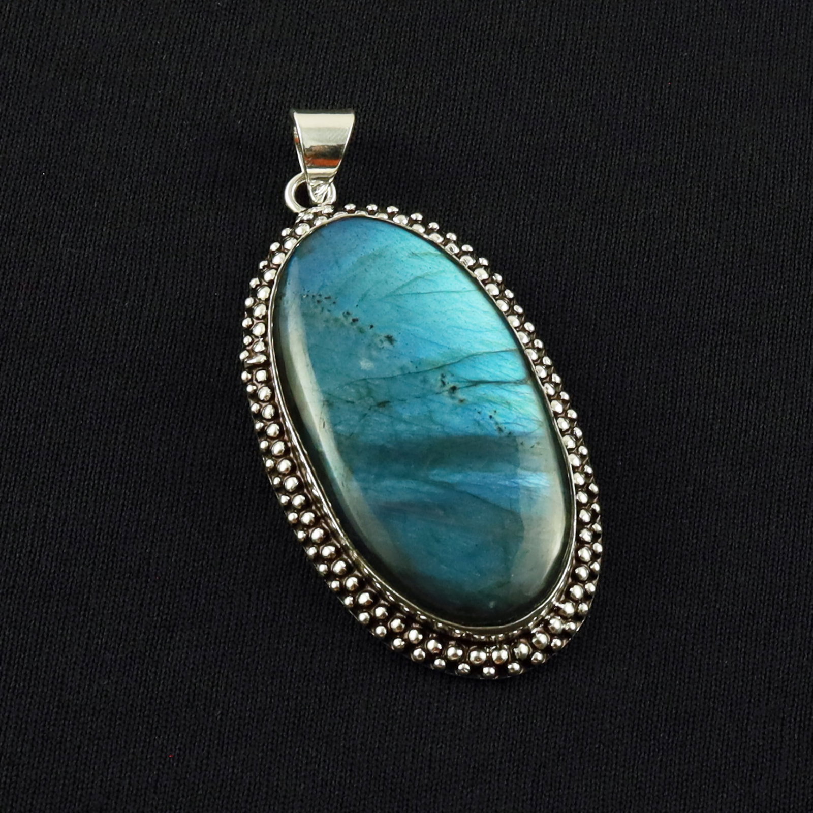 Natural Labradorite Sterling Silver Plated Handmade Pendant: Product ID: 260701134437 Product - Handmade Silver Plated Pendant Metal - 92.5 Sterling Silver Plated Pendant Size - 5x2.5 CM Gemstone - Labradorite Gemstone Origin - Canada Gemstone Shape - Oval Pend