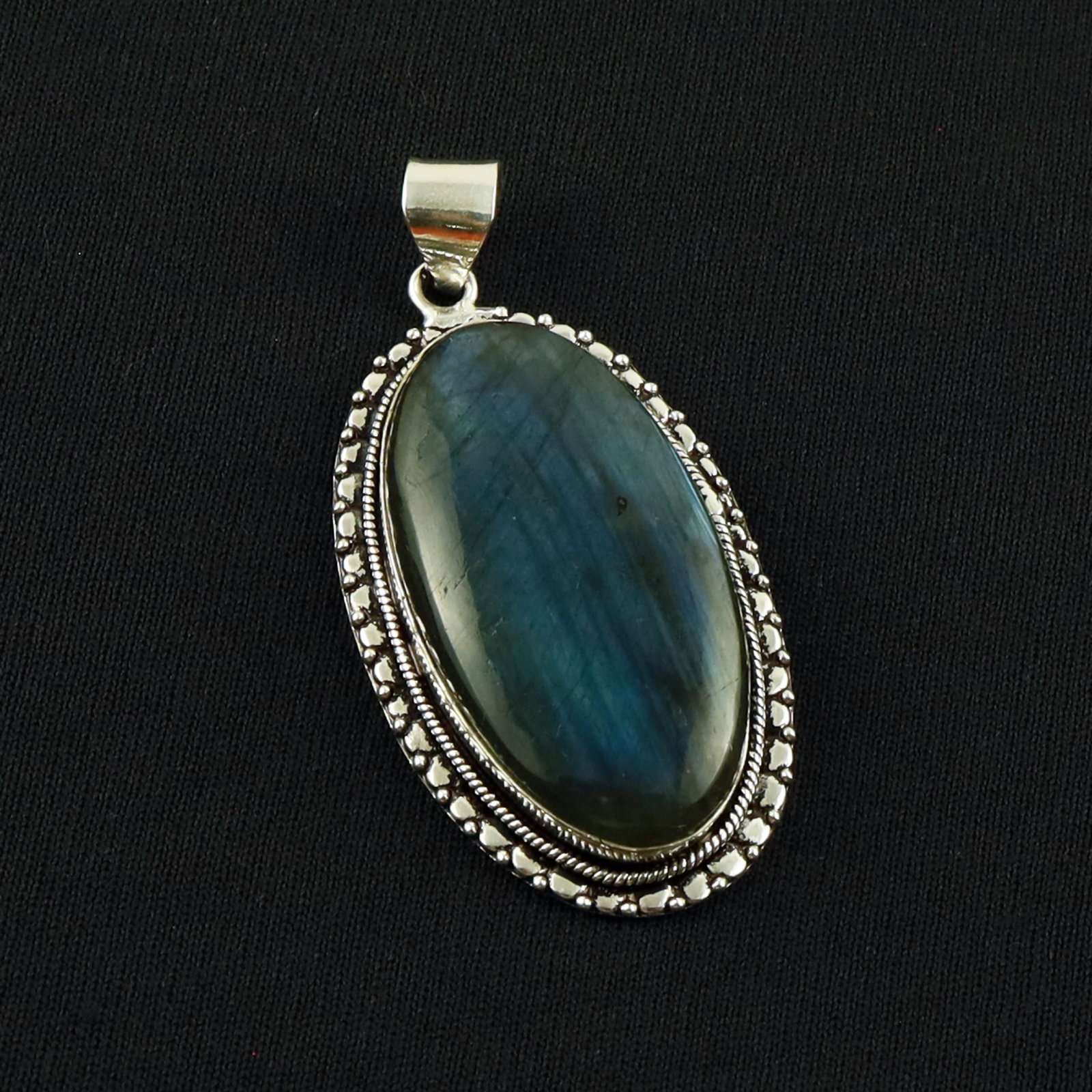 Natural Labradorite Sterling Silver Plated Handmade Pendant: Product ID: 260701134526 Product - Handmade Silver Plated Pendant Metal - 92.5 Sterling Silver Plated Pendant Size - 4.5X2.5 CM Gemstone - Labradorite Gemstone Origin - Canada Gemstone Shape - Oval Pe