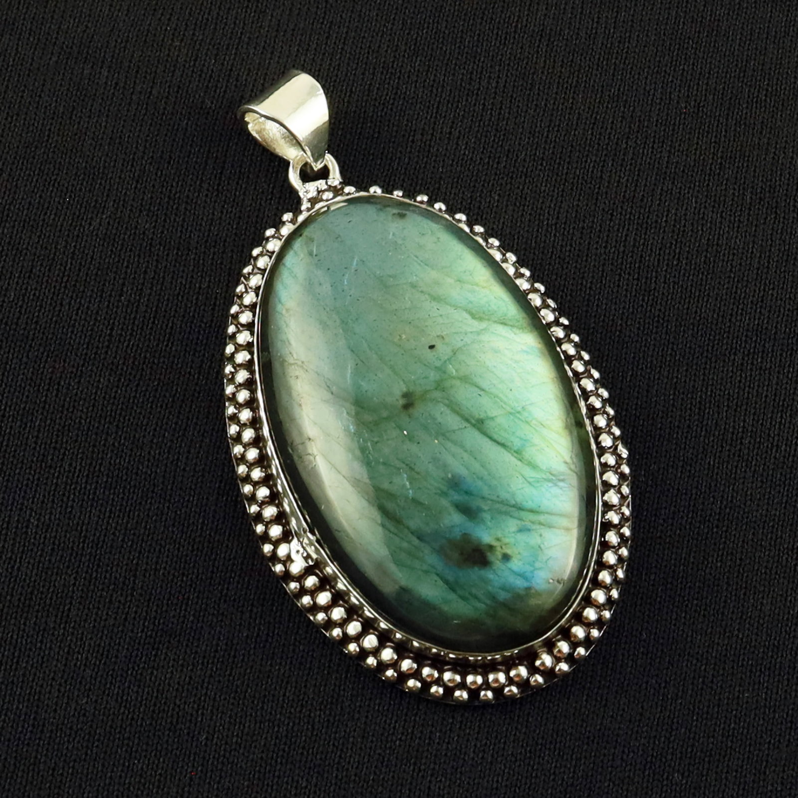 Natural Labradorite Sterling Silver Plated Handmade Pendant: Product ID: 260701133934 Product - Handmade Silver Plated Pendant Metal - 92.5 Sterling Silver Plated Pendant Size - 5x3 CM Gemstone - Labradorite Gemstone Origin - Canada Gemstone Shape - Oval Pendan