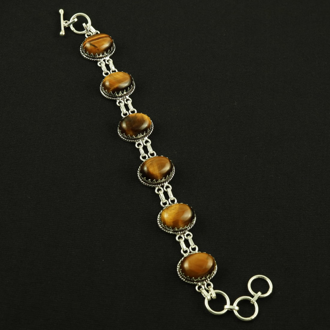 Natural Tiger Eye Sterling Silver Plated Handmade Bracelet: Product ID: 260608184236 Product - Handmade Silver Plated Bracelet Metal - 92.5 Sterling Silver Plated Bracelet Length - 6 Inch + 2 Inch Gemstone - Tiger Eye Gemstone Size -12X16 ( 6 Stone) Gemstone O