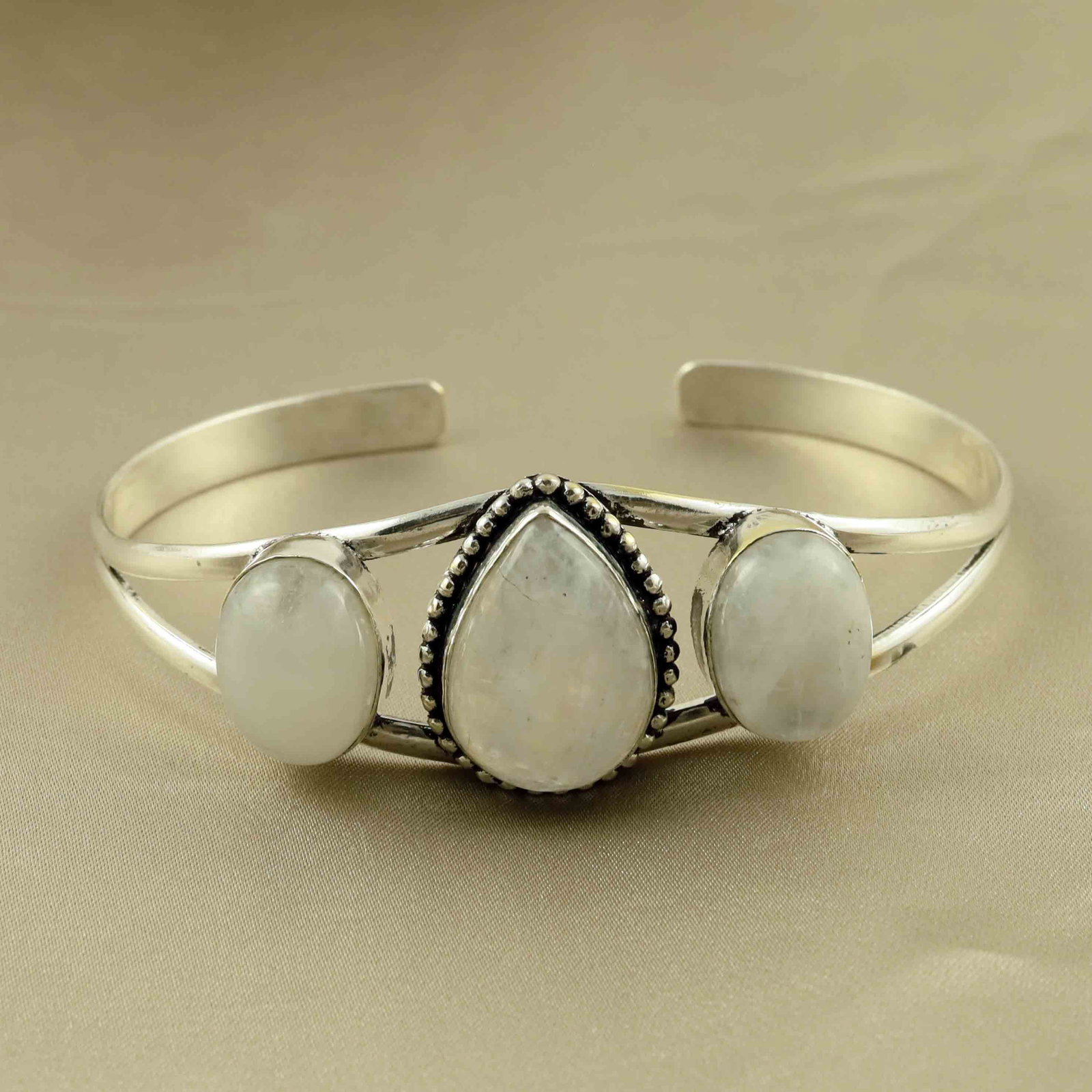 Natural Rainbow Moonstone Sterling Silver Plated Handmade Cuff Bangle: Product ID: 260524154639 Product - Handmade Silver Plated Cuff Bangle Metal - 92.5 Sterling Silver Plated Bangle Size - 7.5x5.5 CM (Adjustable) Gemstone - Rainbow Moonstone Gemstone Origin - India Gem
