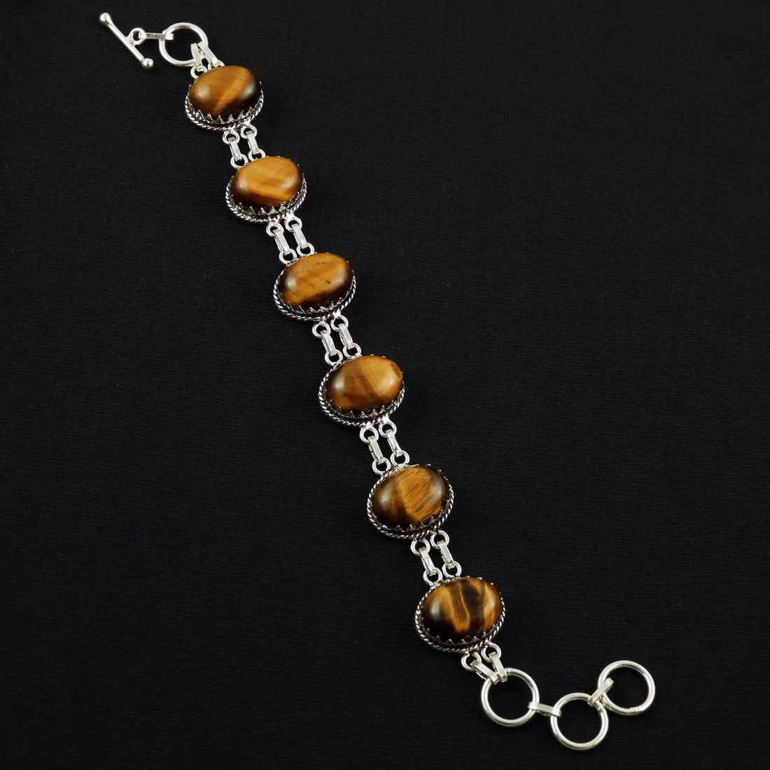 Natural Tiger Eye Sterling Silver Plated Handmade Bracelet: Product ID: 260608184111 Product - Handmade Silver Plated Bracelet Metal - 92.5 Sterling Silver Plated Bracelet Length - 6 Inch + 2 Inch Gemstone - Tiger Eye Gemstone Size -12X16 ( 6 Stone) Gemstone O