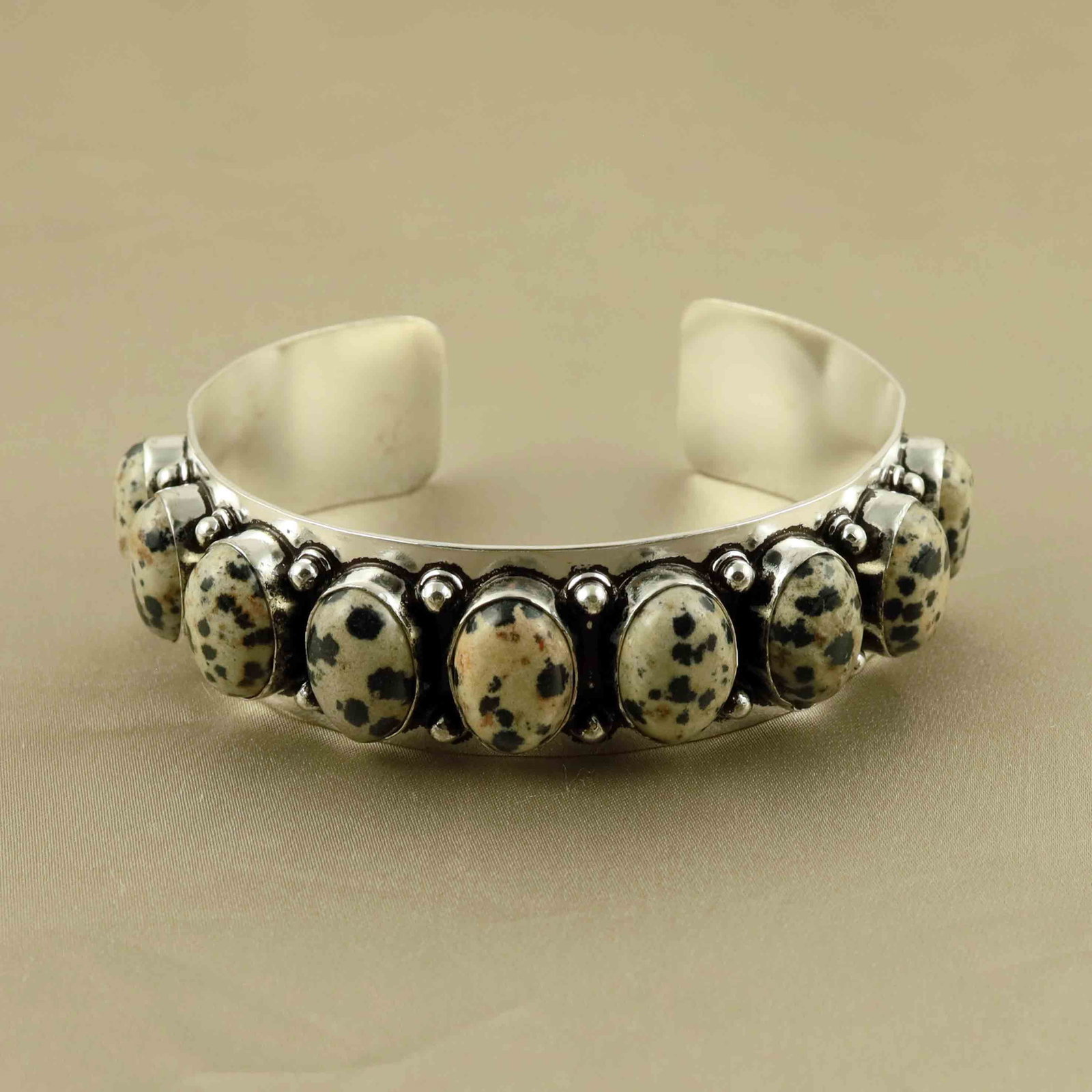 Natural Dalmatian Jasper Sterling Silver Plated Handmade Cuff Bangle: Product ID: 260607150318 Product - Handmade Silver Plated Cuff Bangle Metal - 92.5 Sterling Silver Plated Bangle Size - 6.5x5.5 CM (Adjustable) Gemstone - Dalmatian Jasper Gemstone Origin - Mexico Gem