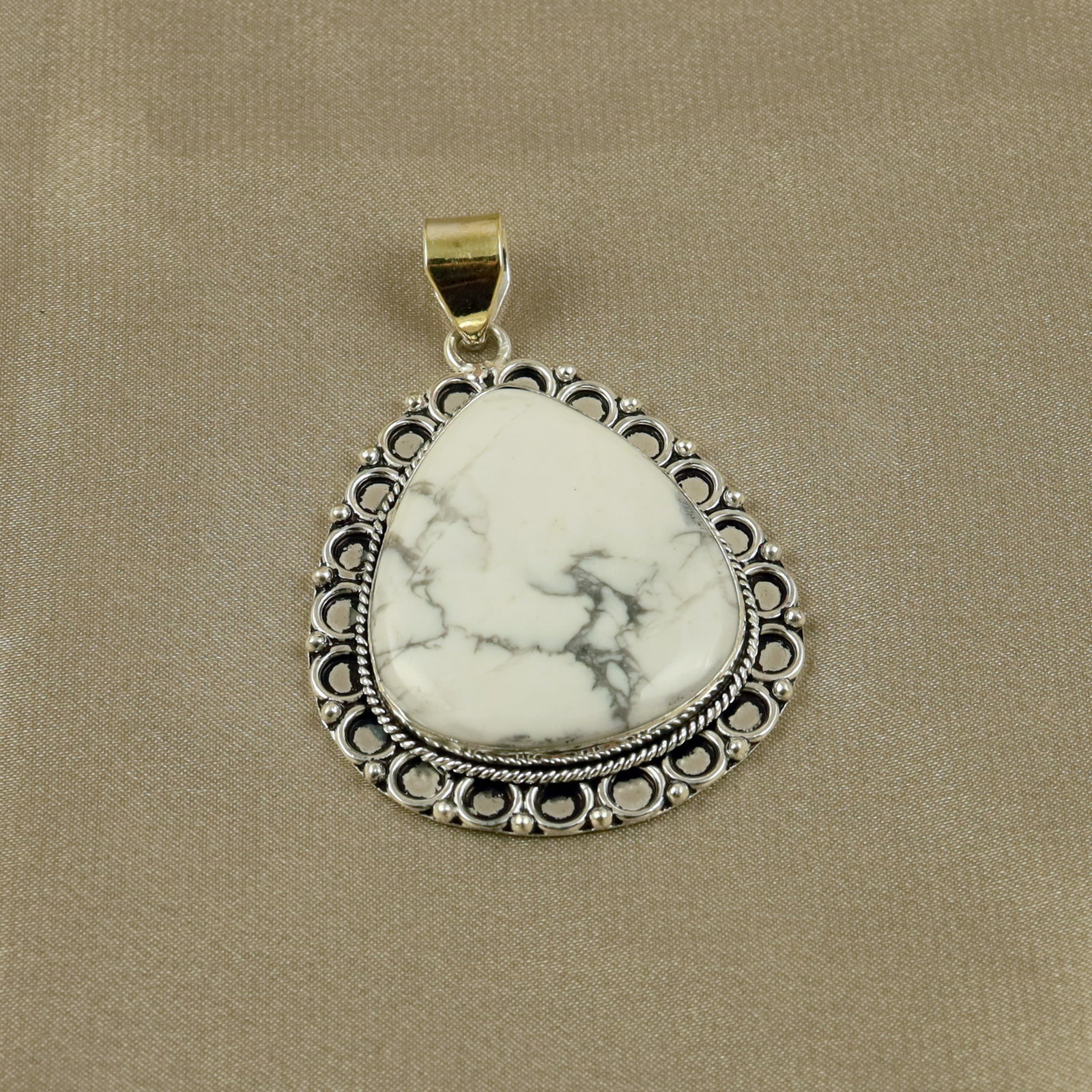 Natural Howlite Sterling Silver Plated Handmade Pendant: Product ID: 260518140004 Product - Handmade Silver Plated Pendant Metal - 92.5 Sterling Silver Plated Pendant Size - 4x3.5CM Gemstone - Howlite Gemstone Origin - Canada Gemstone Shape - Pear Pendant W