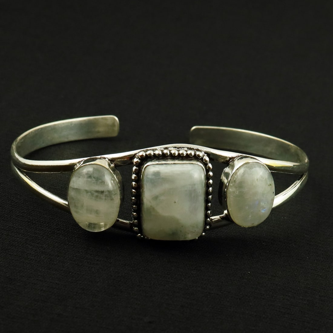 Natural Rainbow Moonstone Sterling Silver Plated Handmade Cuff Bangle: Product ID: 260521155106 Product - Handmade Silver Plated Cuff Bangle Metal - 92.5 Sterling Silver Plated Bangle Size - 7.5x5.5 CM (Adjustable) Gemstone - Rainbow Moonstone Gemstone Origin - India Gem