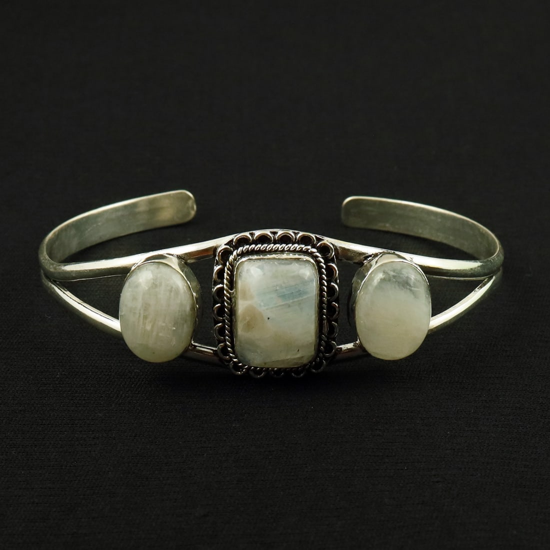 Natural Rainbow Moonstone Sterling Silver Plated Handmade Cuff Bangle: Product ID: 260521155007 Product - Handmade Silver Plated Cuff Bangle Metal - 92.5 Sterling Silver Plated Bangle Size - 7.5x5.5 CM (Adjustable) Gemstone - Rainbow Moonstone Gemstone Origin - India Gem