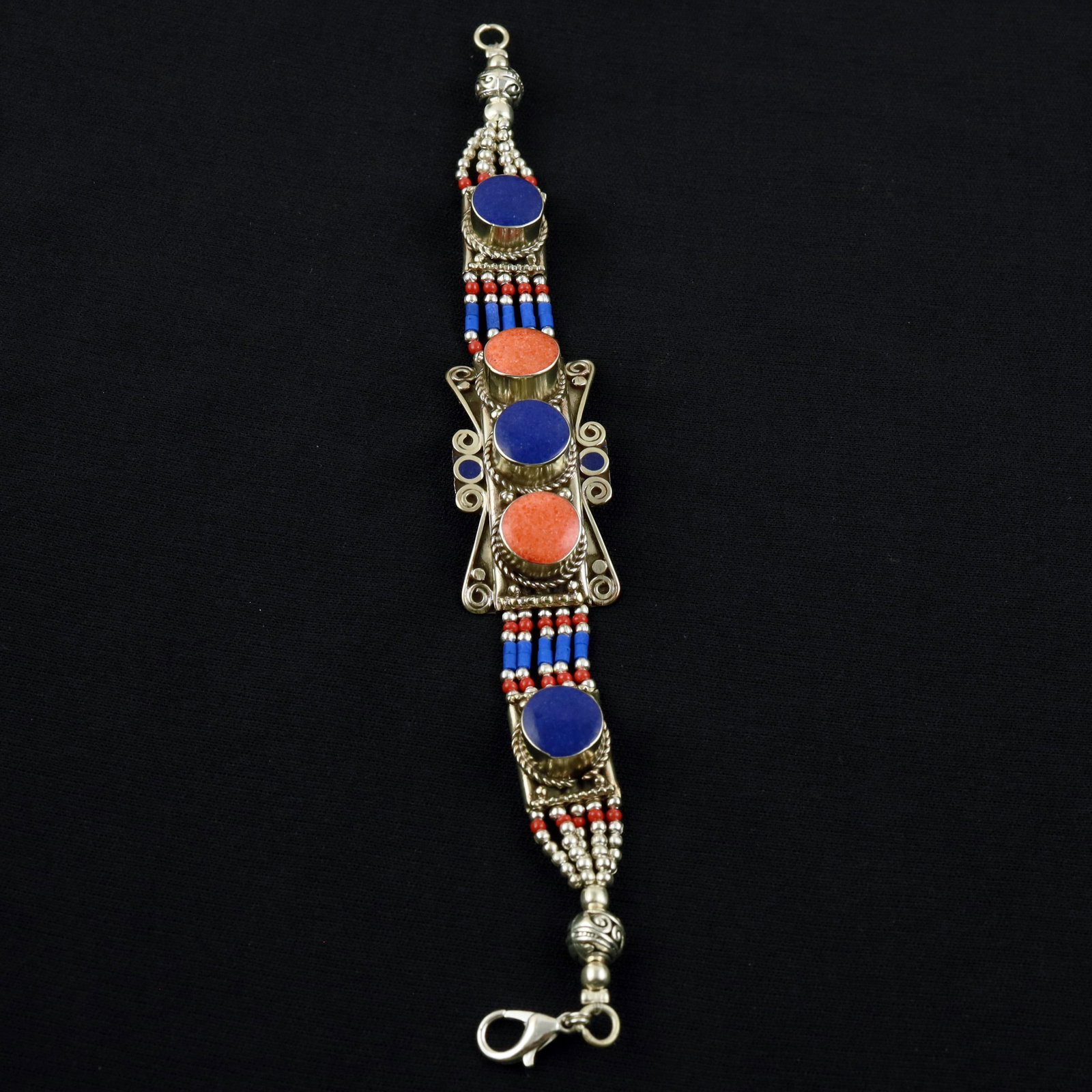 Natural Lapis Lazuli & Red Coral Handmade Tibetan Bracelet: Product ID: 260520120112 Product - Tibetan Handmade Ethnic Bracelet Gemstone - Natural Lapis Lazuli & Coral Size - 7 Inch Weight - 50 Gram Approx Metal - Brass & Copper mix Metal Origin - Nepal Countr