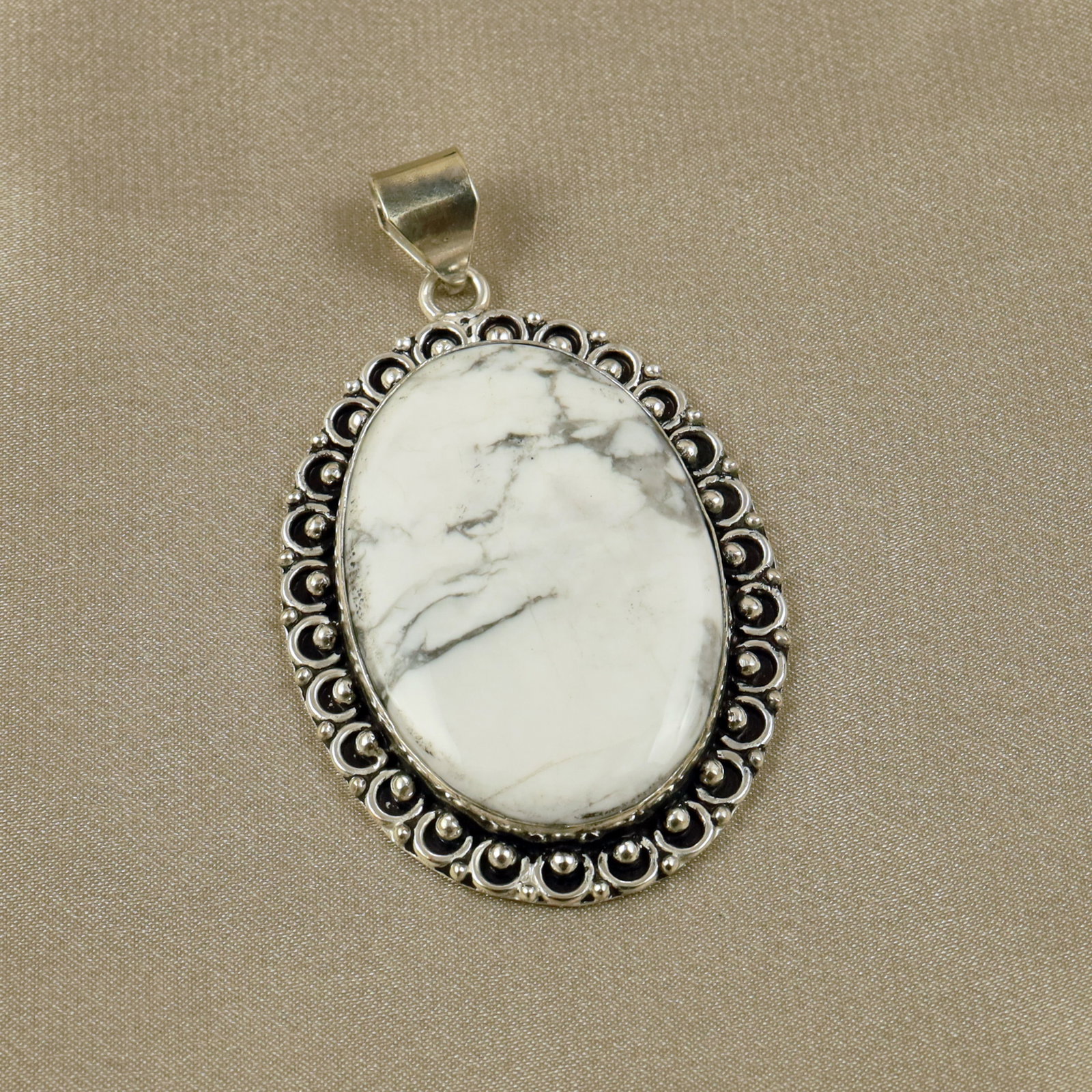 Natural Howlite Sterling Silver Plated Handmade Pendant: Product ID: 260518140158 Product - Handmade Silver Plated Pendant Metal - 92.5 Sterling Silver Plated Pendant Size - 5x3.5CM Gemstone - Howlite Gemstone Origin - Canada Gemstone Shape - Oval Pendant W