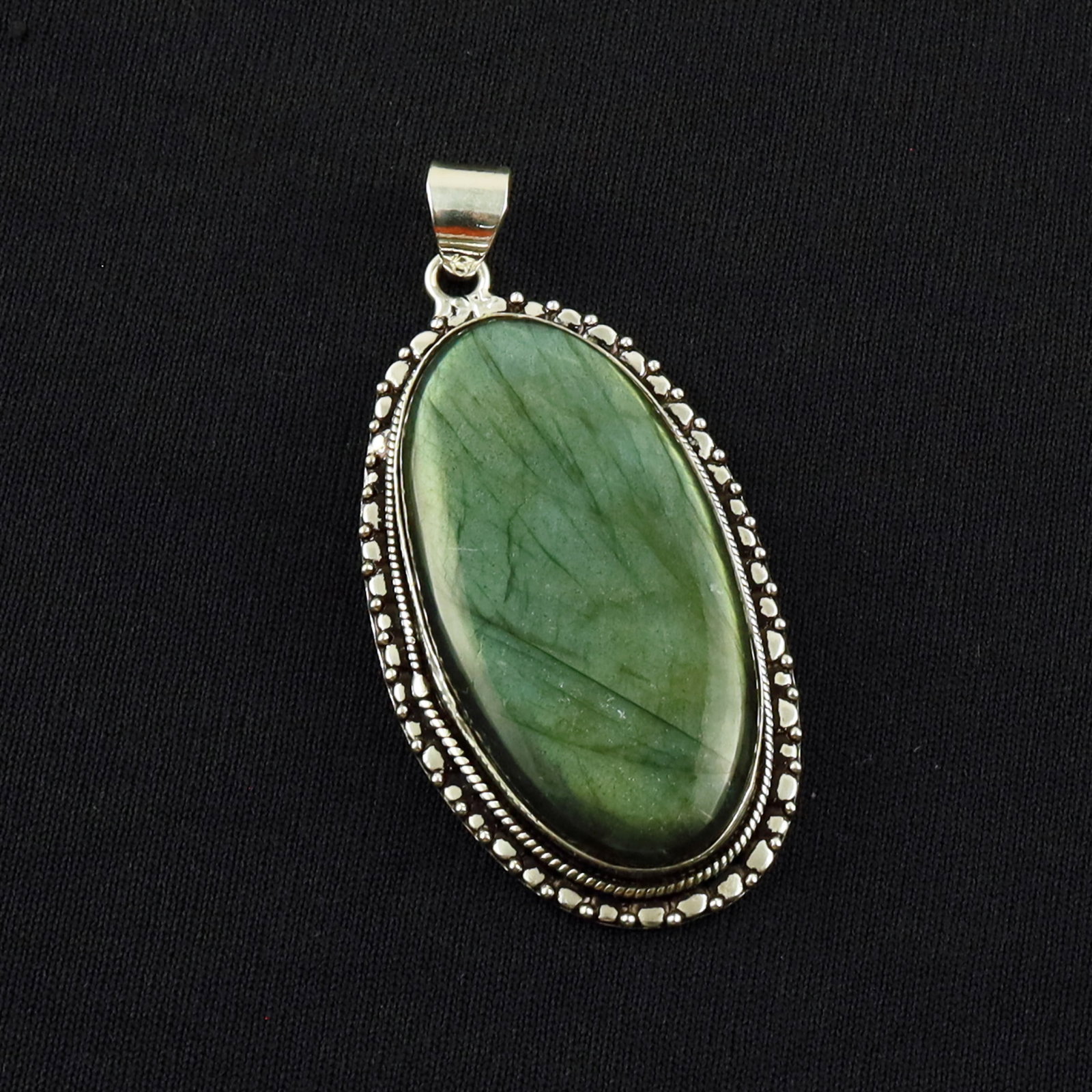 Natural Labradorite Sterling Silver Plated Handmade Pendant: Product ID: 260701134340 Product - Handmade Silver Plated Pendant Metal - 92.5 Sterling Silver Plated Pendant Size - 5x2.5 CM Gemstone - Labradorite Gemstone Origin - Canada Gemstone Shape - Oval Pend
