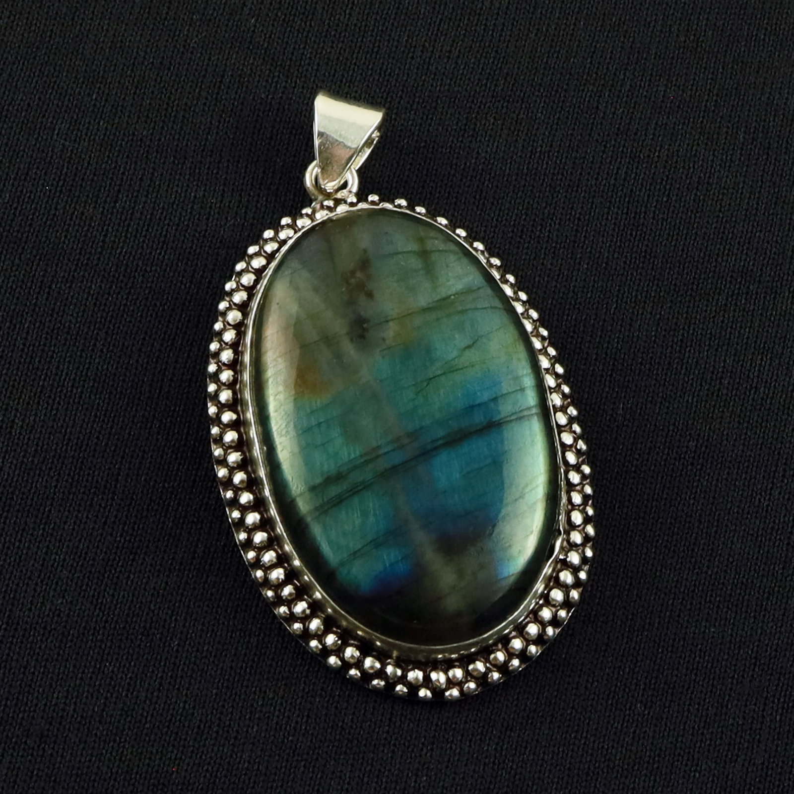Natural Labradorite Sterling Silver Plated Handmade Pendant: Product ID: 260701134229 Product - Handmade Silver Plated Pendant Metal - 92.5 Sterling Silver Plated Pendant Size - 4.5x3 CM Gemstone - Labradorite Gemstone Origin - Canada Gemstone Shape - Oval Pend