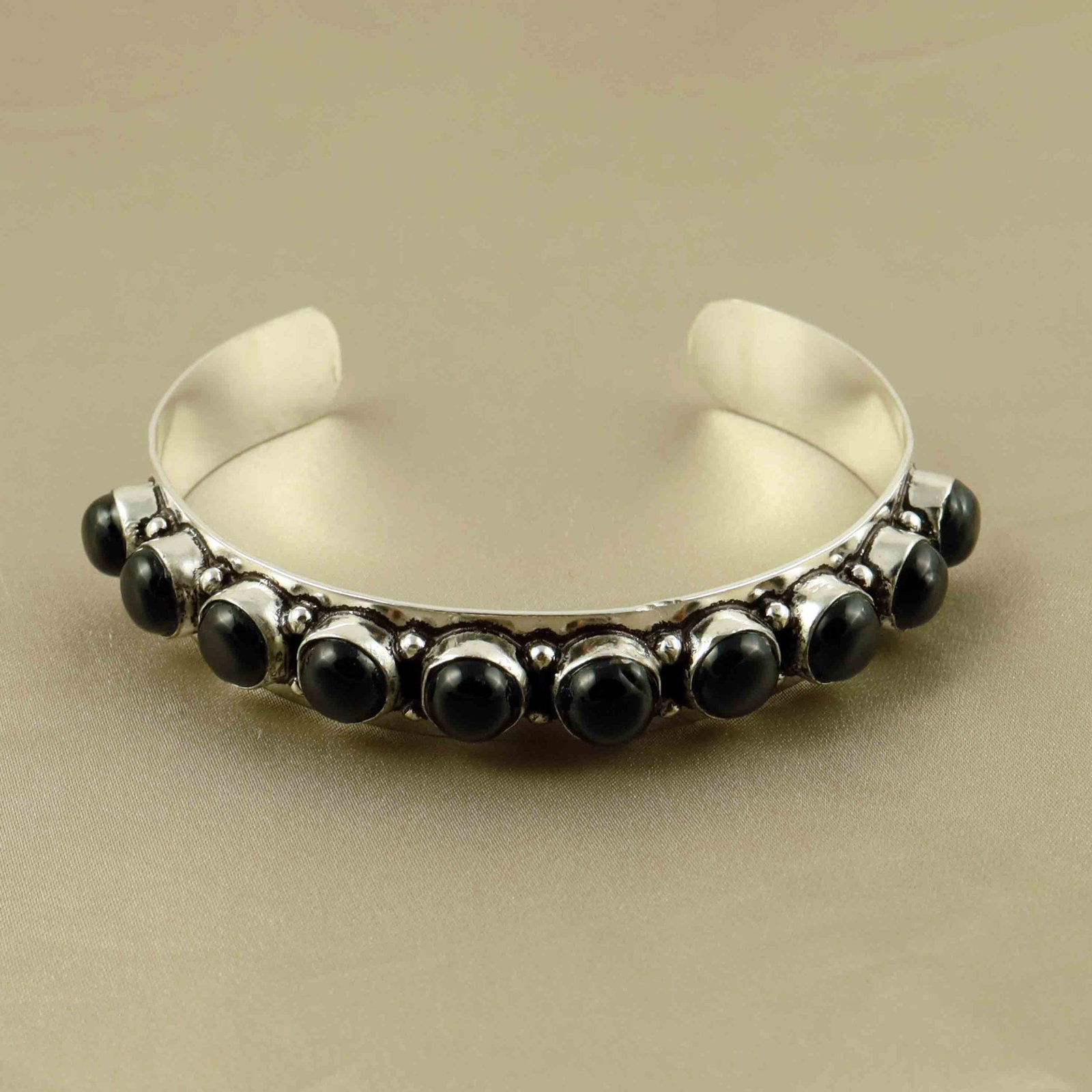 Natural Black Onyx Sterling Silver Plated Handmade Cuff Bangle: Product ID: 260607182418 Product - Handmade Silver Plated Cuff Bangle Metal - 92.5 Sterling Silver Plated Bangle Size - 6.5x5.5 CM (Adjustable) Gemstone - Black Onyx Gemstone Origin - India Gemstone S
