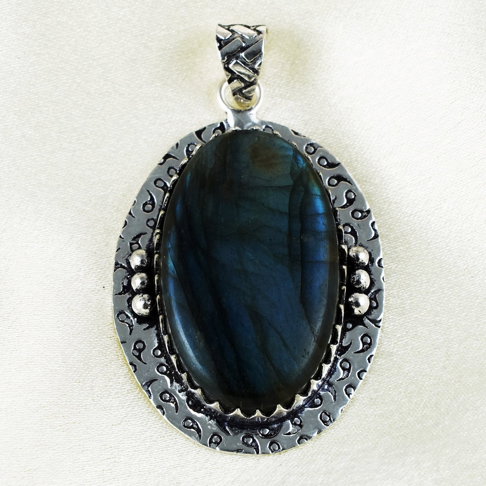 Natural Labradorite Sterling Silver Plated Handmade Pendant: Product ID: 260401134945 Product - Handmade Silver Plated Pendant Metal - 92.5 Sterling Silver Plated Pendant Size - 4x3 CM Gemstone - Labradorite Gemstone Origin - Canada Gemstone Shape - Oval Pendan