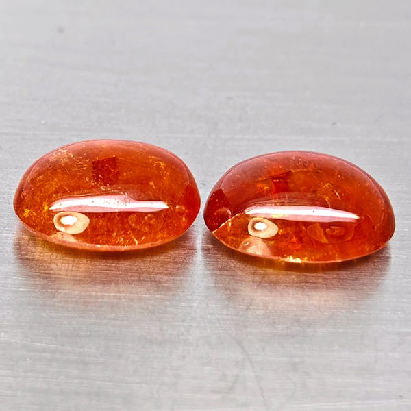 Natural Orangish Red Spessartine Garnet Gemstones 18.20 Ct. 2 Pcs. Oval Cabochon Shape and Mixed: Product ID: 802938020 Product Name: Natural Garnet Weight: 18.20 CT. Size: 13.4 x 11 x 6.1 to 13 x 10.2 x 6 MM. Shape: Oval Cabochon Color: Orangish Red Clarity:SI1 Luster: Good Gems Origin: Namibia T