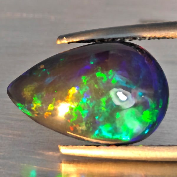 Natural Multi Color Play Of Colour Opal Gemstones 2.93 Ct. Pear Cabochon Shape 14.5 x 9.5 Mm.: Product ID: 818728532 Product Name: Natural Opal Weight: 2.93 CT. Size: 14.5 x 9.5 x 5.3 MM. Shape: Pear Cabochon Color: Multi-Color Clarity:Semi - Transparent Luster: Good Gems Origin: Ethiopia Treat