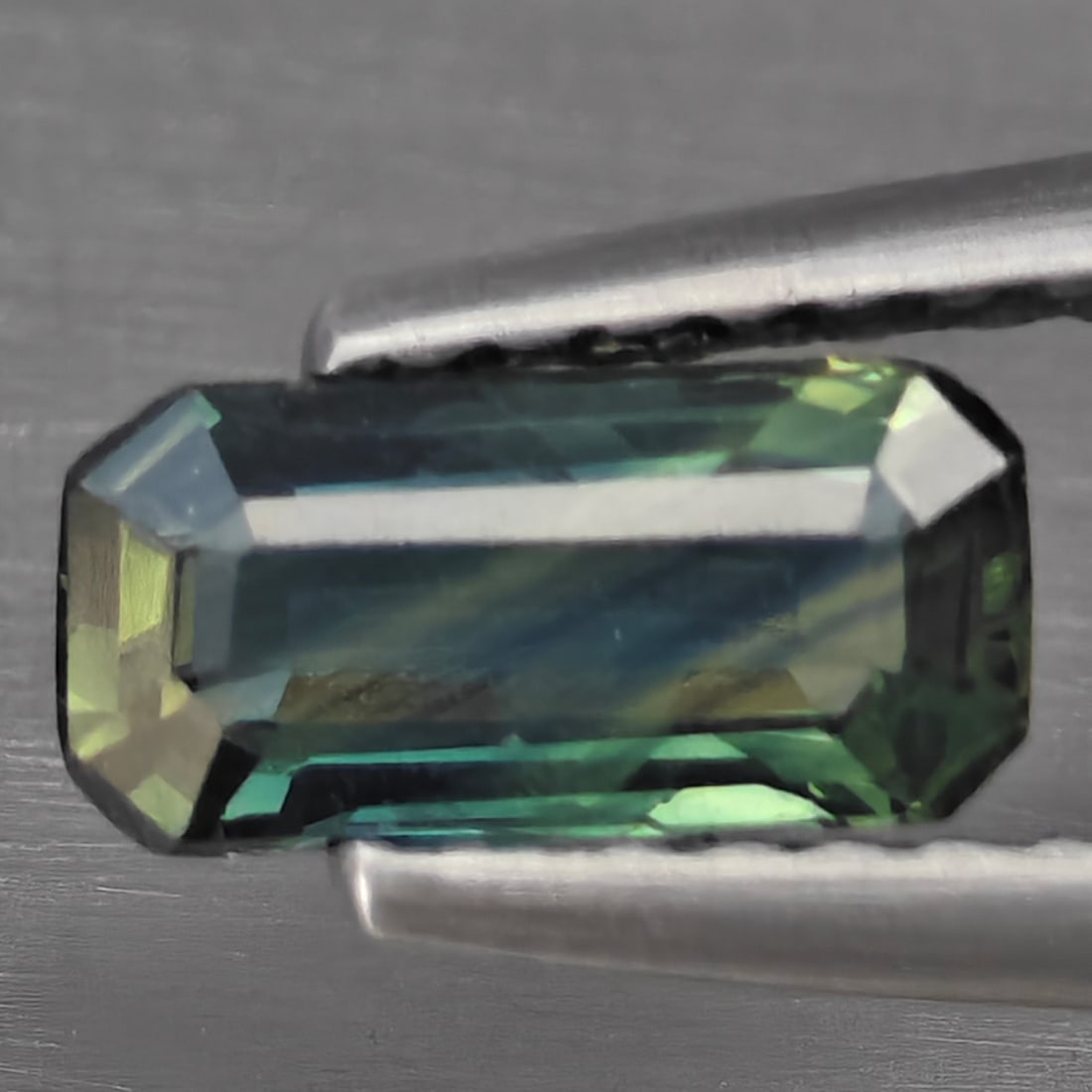 Natural Greenish Blue Sapphire Gemstones 0.77 Ct. Octagon Shape 8 x 3.8 Mm.: Product ID: 806130421 Product Name: Natural Green Sapphire Weight: 0.77 CT. Size: 8 x 3.8 x 2.5 MM. Shape: Octagon Color: Greenish Blue Clarity:SI1 Luster: Good Gems Origin: Thailand Treatment: Heated