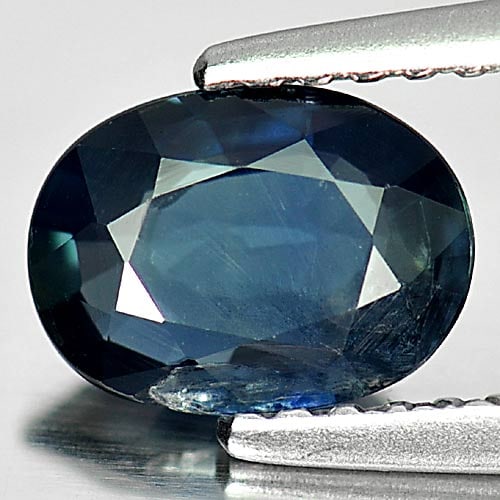 Natural Deep Blue Sapphire Gemstones 1.00 Ct. Oval Shape 7.4 x 5.5 Mm.: Product ID: 806011382 Product Name: Natural Blue Sapphire Weight: 1.00 CT. Size: 7.4 x 5.5 x 2.6 MM. Shape: Oval Color: Deep Blue Clarity:VSI Luster: Good Gems Origin: Thailand Treatment: Heated Cryst
