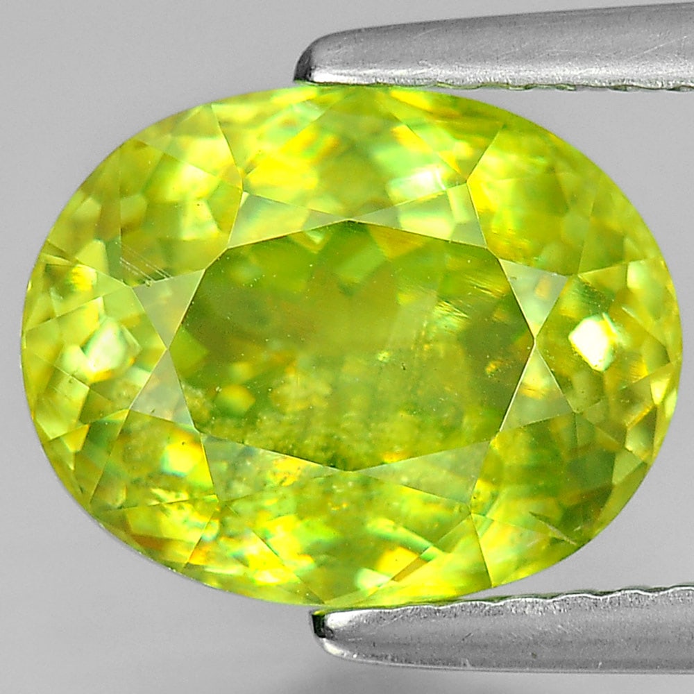 Natural Multi Color Titanium Sphene Gemstones Red Spark 3.59 Ct. Oval Shape 10.5 x 8.3 Mm.: Product ID: 806502937 Product Name: Natural Sphene Weight: 3.59 CT. Size: 10.5 x 8.3 x 5.3 MM. Shape: Oval Color: Multi-Color Clarity:SI1 Luster: Adamantine Gems Origin: Mardagascar Treatment: Unheate