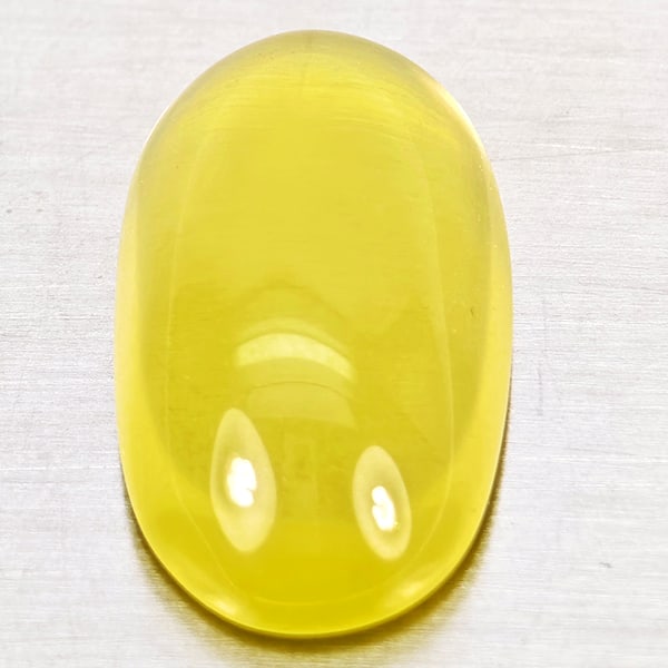 Natural Yellow Lemon Quartz Gemstones 11.46 Ct. Oval Cabochon Shape 20 x 11.2 Mm.: Product ID: 805530023 Product Name: Natural Quartz Weight: 11.46 CT. Size: 20 x 11.2 x 7 MM. Shape: Oval Cabochon Color: Yellow Lemon Clarity:Semi - Transparent Luster: Good Gems Origin: Brazil Treatm
