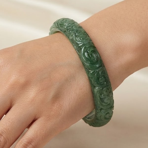 Natural Green Jade Gemstones Bangle 275.00 Ct. Flower Carving Diameter 60 Mm.: Product ID: 818102668 Product Name: Natural Gemstones Weight: 275.00 CT. Size: 75 x 60 x 10 MM. Shape: Round Carving Color: Green Clarity:Semi-Transparent Luster: Good Gems Origin: Burma Treatment: Un