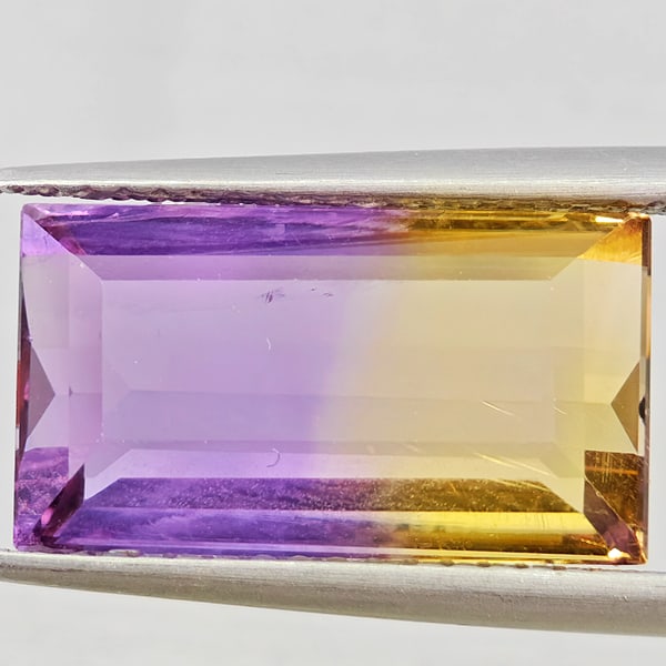 Natural Bi Color Ametrine Gemstones 6.38 Ct. Baguette Shape 14.8 x 8.3 Mm.: Product ID: 800408558 Product Name: Natural Ametrine Weight: 6.38 CT. Size: 14.8 x 8.3 x 6 MM. Shape: Baguette Color: Bi Color Clarity:VSI Luster: Good Gems Origin: Bolivia Treatment: Unheated Crystal