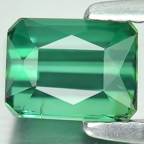 Natural Green Tourmaline Gemstones 1.29 Ct. Octagon Shape 6.6 x 5 Mm.: Product ID: 807250133 Product Name: Natural Tourmaline Weight: 1.29 CT. Size: 6.6 x 5 x 4.5 MM. Shape: Octagon Color: Green Clarity:VSI Luster: Good Gems Origin: Nigeria Treatment: Unheated Crystal St