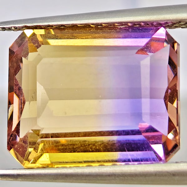 Natural Bi Color Ametrine Gemstones 5.26 Ct. Octagon Shape 11.8 x 9.6 Mm.: Product ID: 800408592 Product Name: Natural Ametrine Weight: 5.26 CT. Size: 11.8 x 9.6 x 5.9 MM. Shape: Octagon Color: Bi Color Clarity:VSI Luster: Good Gems Origin: Bolivia Treatment: Unheated Crysta