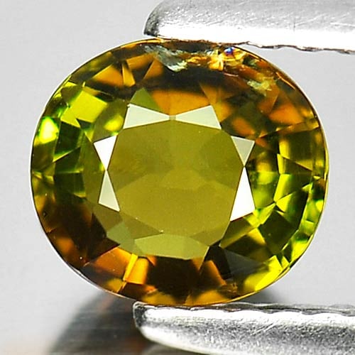 Natural Brown Green Tourmaline Gemstones 0.88 Ct. Oval Shape 6.3 x 5.7 Mm.: Product ID: 807246205 Product Name: Natural Tourmaline Weight: 0.88 CT. Size: 6.3 x 5.7 x 3.6 MM. Shape: Oval Color: Brown Green Clarity:VSI Luster: Good Gems Origin: Nigeria Treatment: Unheated Cryst