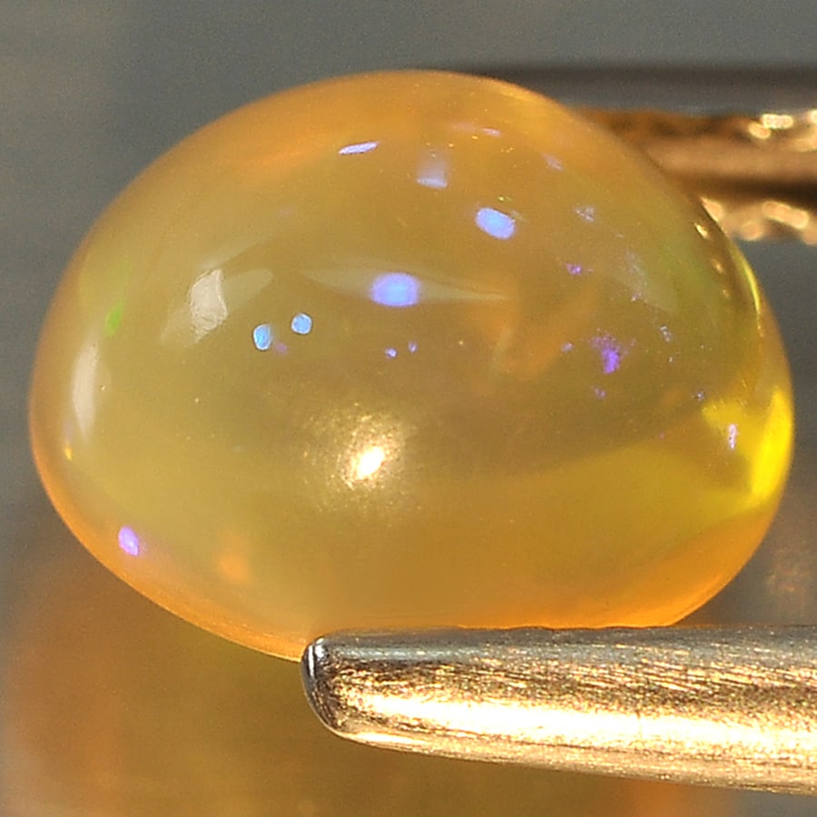 Natural Multi Color Opal Gemstones 1.20 Ct. Oval Cabochon Shape 7.5 x 6.6 Mm.: Product ID: 818715707 Product Name: Natural Opal Weight: 1.20 CT. Size: 7.5 x 6.6 x 4.8 MM. Shape: Oval Cabochon Color: Multi Color Clarity:Opaque Luster: Good Gems Origin: Ethiopia Treatment: Unheate