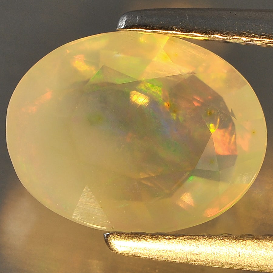 Natural Multi Color Opal Gemstones 1.71 Ct. Oval Shape 10.3 x 8 Mm. (1 of 3)