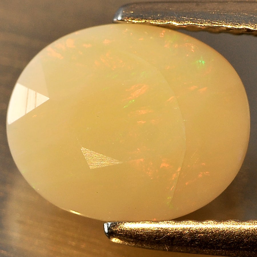 Natural Multi Color Opal Sudan Gemstones 1.47 Ct. Oval Shape 9.5 x 7.9 Mm.: Product ID: 818710550 Product Name: Natural Opal Weight: 1.47 CT. Size: 9.5 x 7.9 x 5.2 MM. Shape: Oval Color: Multi Color Clarity:Semi - Transparent Luster: Good Gems Origin: Ethiopia Treatment: Unhe