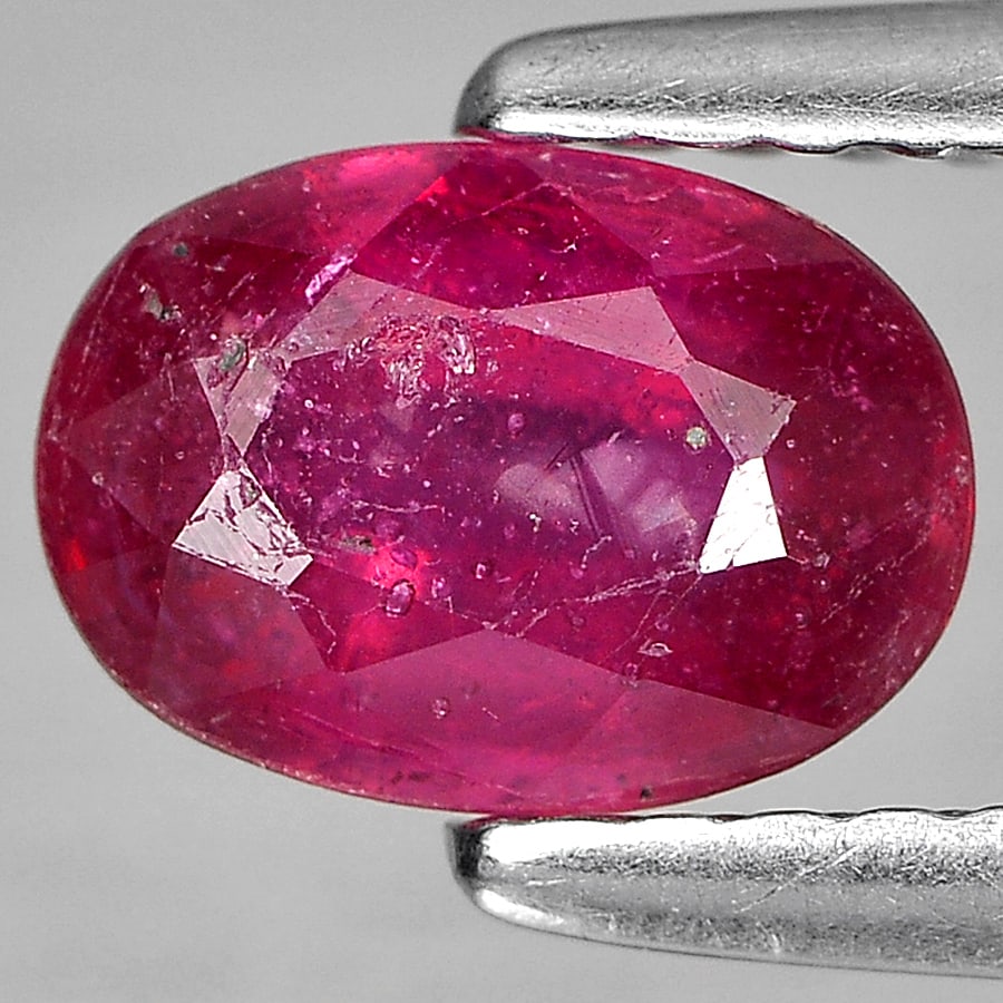 Natural Purplish Red Ruby Gemstones 1.06 Ct. Oval Shape 7.2 x 5 Mm: Product ID: 805934859 Product Name: Natural Ruby Weight: 1.06 CT. Size: 7.2 x 5 x 3 MM. Shape: Oval Color: Red Clarity:SI2 Luster: Good Gems Origin: Madagascar Treatment: Heated (Lead glass fillin Cry
