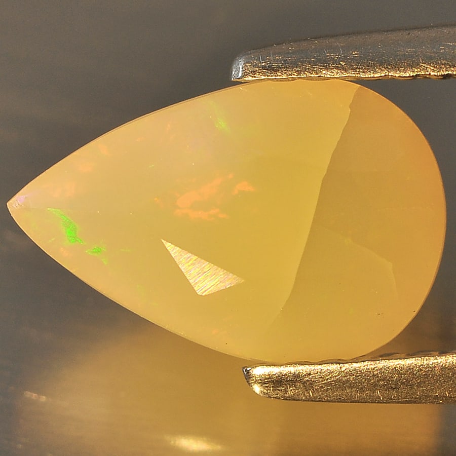 Natural Multi Color Opal Gemstones 1.24 Ct. Pear Shape 10.7 x 7 Mm.: Product ID: 818707406 Product Name: Natural Opal Weight: 1.24 CT. Size: 10.7 x 7 x 4.8 MM. Shape: Pear Color: Multi Color Clarity:Opaque Luster: Good Gems Origin: Ethiopia Treatment: Unheated Crystal 