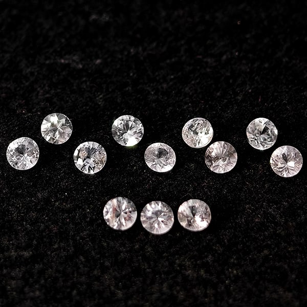 Natural White Sapphire Gemstones 0.47 Ct. 12 Pcs Round Diamond Cut 1.9 Mm.: Product ID: 806162977 Product Name: Natural White Sapphire Weight: 0.47 CT. Size: 1.9 x 1.9 x 1.5 MM. Shape: Round Diamond Cut Color: White Clarity:VSI Luster: Good Gems Origin: Sri - Lanka Treatment: