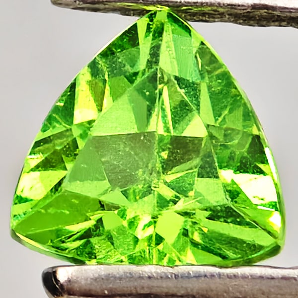 Natural Green Tsavorite Garnet Gemstones 0.28 Ct. Trilliant Shape 4.2 x 4.2 Mm.: Product ID: 803005092 Product Name: Natural Tsavorite Weight: 0.28 CT. Size: 4.2 x 4.2 x 2.5 MM. Shape: Trilliant Shape Color: Green Clarity:SI Luster: Good Gems Origin: Tanzania Treatment: Unheated C