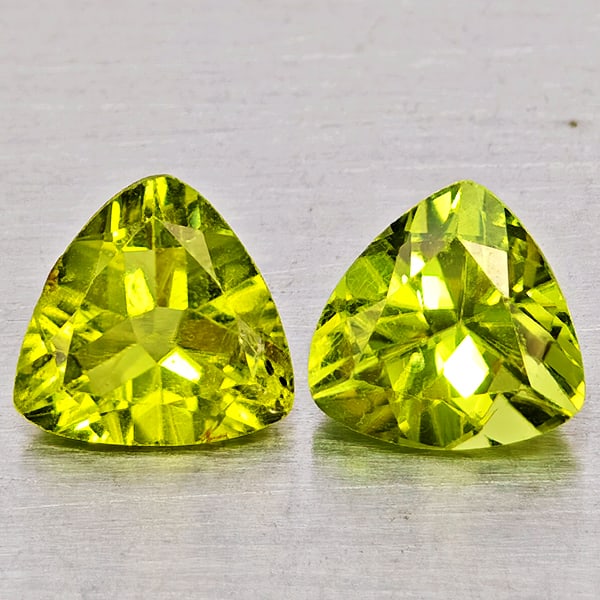 Natural Green Peridot Gemstones 1.68 Ct. 2 Pcs Trilliant Shape 6.4 Mm.: Product ID: 805317515 Product Name: Natural Peridot Weight: 1.68 CT. Size: 6.4 x 6.4 x 3.3 MM. Shape: Trilliant Color: Green Clarity:VSI Luster: Good Gems Origin: Pakistan Treatment: Unheated Crystal 
