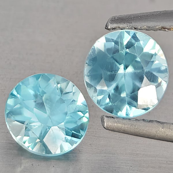 Natural Blue Zircon Gemstones 1.30 Ct. 2 Pcs. Round Diamond Cut 5.3 Mm.: Product ID: 807743250 Product Name: Natural Zircon Weight: 1.30 CT. Size: 5.3 x 5.3 x 3.3 MM. Shape: Round Diamond Cut Color: Blue Clarity:SI1 Luster: Good Gems Origin: Cambodia Treatment: Heated Crys
