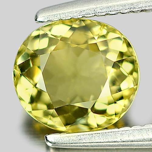 Natural Greenish Yellow Tourmaline Gemstones 0.92 Ct. Oval Shape 6.5 x 5.9 Mm.: Product ID: 807246022 Product Name: Natural Tourmaline Weight: 0.92 CT. Size: 6.5 x 5.9 x 3.6 MM. Shape: Oval Color: Greenish Yellow Clarity:VSI Luster: Good Gems Origin: Nigeria Treatment: Unheated C