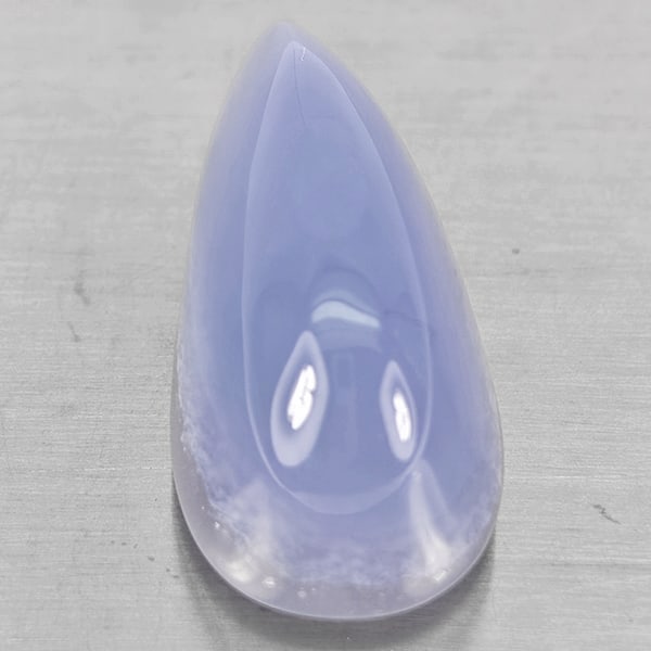 Natural Lavender Chalcedony Gemstones 45.16 Ct. Pear Cabochon Shape 32 x 15 Mm.: Product ID: 801502655 Product Name: Natural Chalcedony Weight: 45.16 CT. Size: 32 x 15 x 15.3 MM. Shape: Pear Cabochon Color: Lavender Clarity:Semi - Transparent Luster: Good Gems Origin: Russia Treat