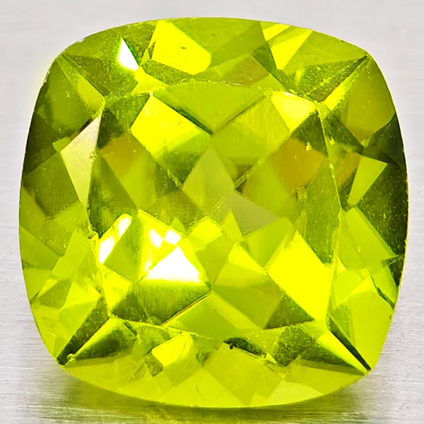 Natural Green Peridot Gemstones 1.69 Ct. Cushion Shape 7.1 Mm.: Product ID: 805317233 Product Name: Natural Peridot Weight: 1.69 CT. Size: 7.1 x 7.1 x 4.5 MM. Shape: Cushion Shape Color: Green Clarity:VSI - SI1 Luster: Good Gems Origin: Pakistan Treatment: Unheate