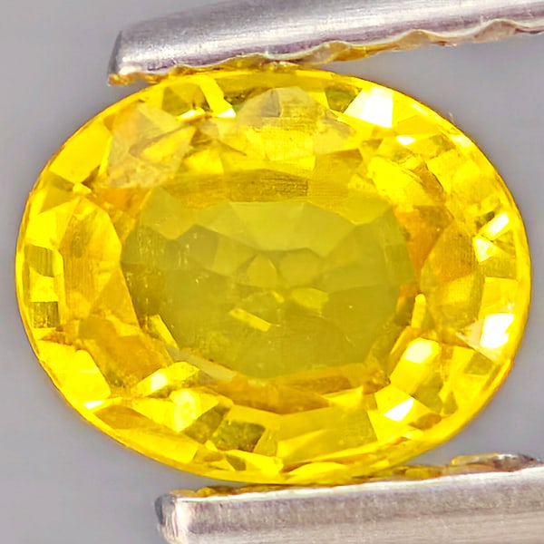 Natural Yellow Sapphire Gemstones 0.46 Ct. Oval Shape 5.3 x 4.3 Mm.: Product ID: 806162795 Product Name: Natural Yellow Sapphire Weight: 0.46 CT. Size: 5.3 x 4.3 x 2.4 MM. Shape: Oval Shape Color: Yellow Clarity:VSI Luster: Good Gems Origin: Thailand Treatment: Heated 
