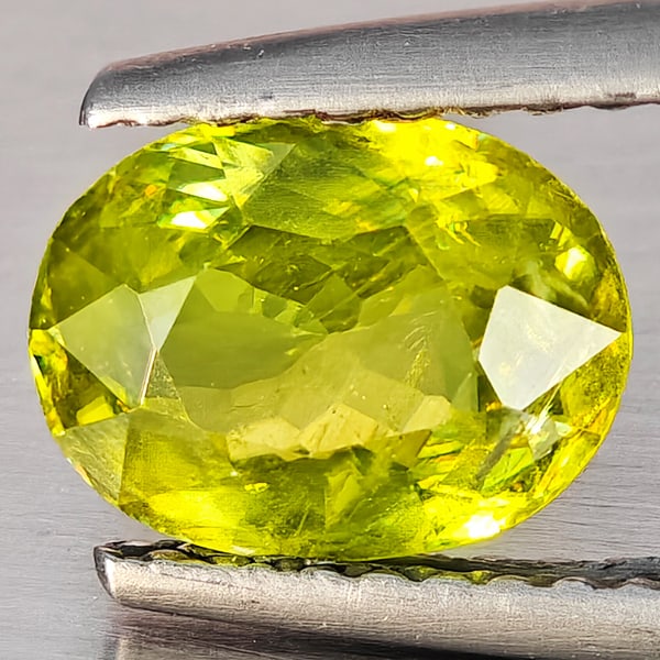 Natural Multi-Color With Rainbow Spark Sphene Gemstones 1.44 Ct. Oval Shape 8 x 6.3 Mm.: Product ID: 806509229 Product Name: Natural Sphene Weight: 1.44 CT. Size: 8 x 6.3 x 3.7 MM. Shape: Oval Shape Color: Multi-Color Clarity:SI1 Luster: Good Gems Origin: Madagascar Treatment: Unheated Cr