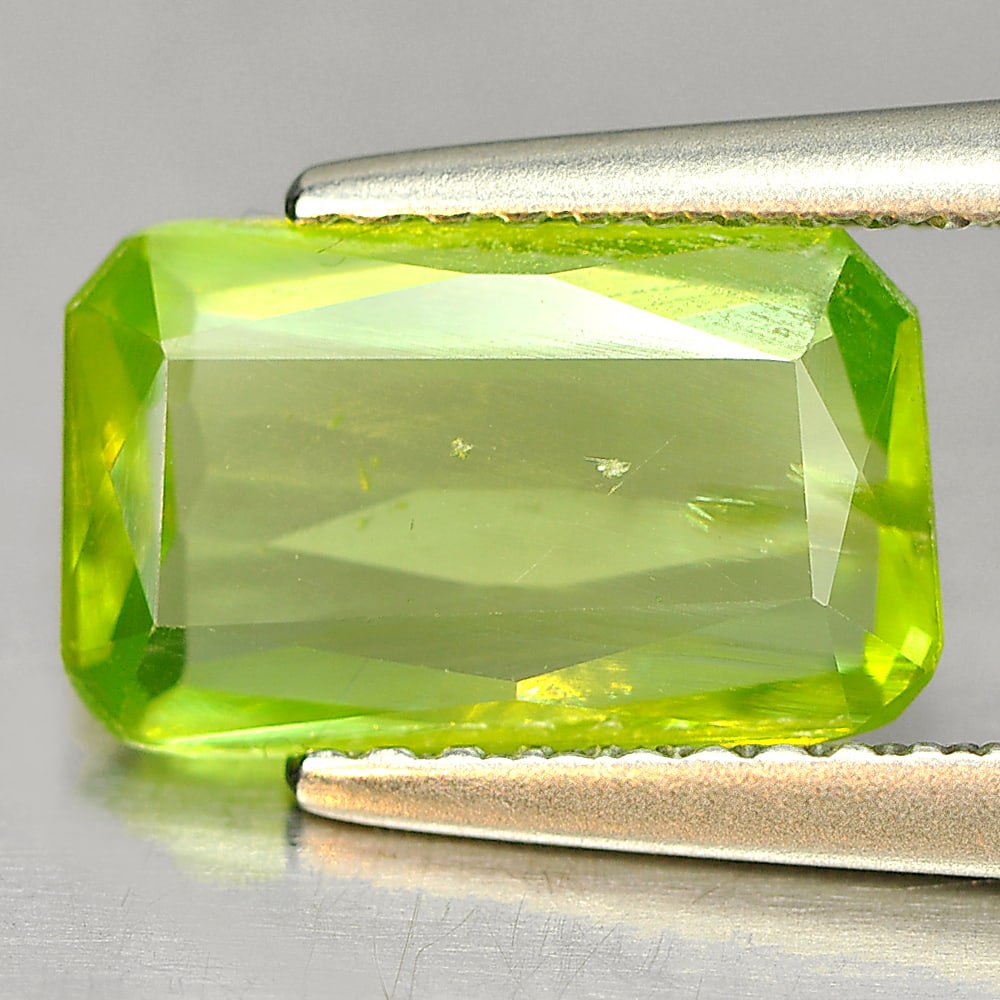 Natural Green Titanium Sphene Sphene Gemstones With Rainbow Spark 1.76 Ct. Octagon Shape 10.4 x 6.3: Product ID: 806507863 Product Name: Natural Sphene Weight: 1.76 CT. Size: 10.4 x 6.3 x 2.2 MM. Shape: Octagon Color: Green With Rainbow Spark Clarity:SI1 Luster: Good Gems Origin: Madagascar Treatment