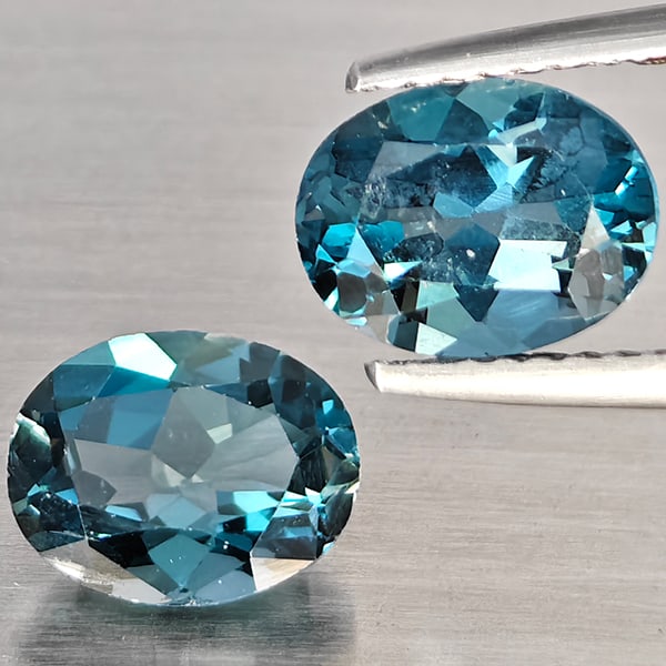 Natural London Blue Topaz Gemstones 3.94 Ct. 2 Pcs. Oval Shape 9 x 7.3 Mm.: Product ID: 807168905 Product Name: Natural Blue Topaz Weight: 3.94 CT. Size: 9 x 7.3 x 4.5 MM. Shape: Oval Color: London Blue Clarity:SI1 Luster: Good Gems Origin: Brazil Treatment: Treated Crystal S